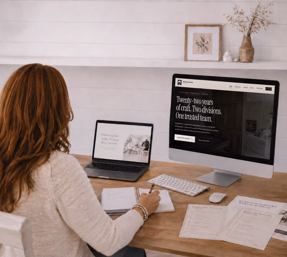 JMACK Built website and print materials on a desk